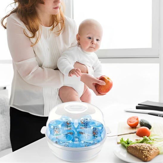 Baby bottle sterilizer with blue bottles, mom holding baby near kitchen table with fresh food