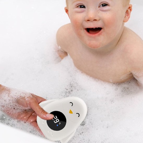 Baby bath thermometer with cute penguin design, ensuring safe water temperature for happy baby bath time