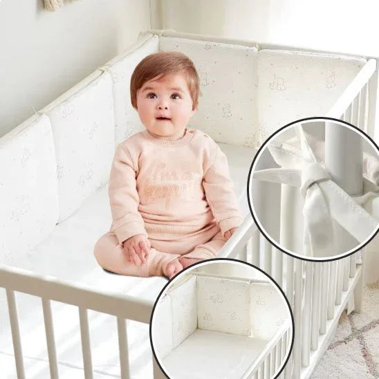 Baby in crib with soft bumper pads, cozy sleep accessories for gentle nights