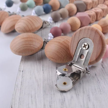 Wooden baby teething necklace with metal clasp, soft pastel beads for soothing and comfort