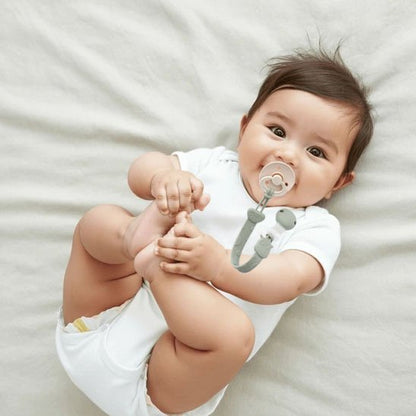 Attache tetine bébé sans BPA, facile à nettoyer, coloris pastel doux et modernes