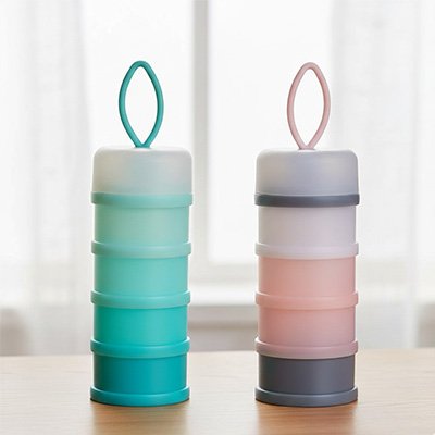 Stackable baby formula dispensers in teal and pink, ideal for travel and feeding on-the-go