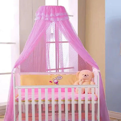Pink baby crib with canopy, teddy bear, and soft bedding for sweet sleep