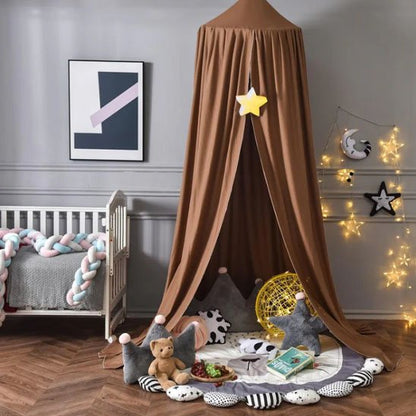 Cozy baby play tent with star decor, soft toys, and nursery bedding for sweet sleep