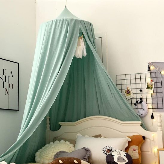 Mint green baby canopy bed tent with soft drapes, cozy nursery decor for sweet sleep