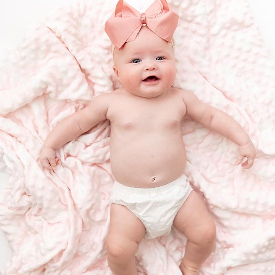 Couverture bébé gaufrée face rose tendre réconfortante pour le coucher