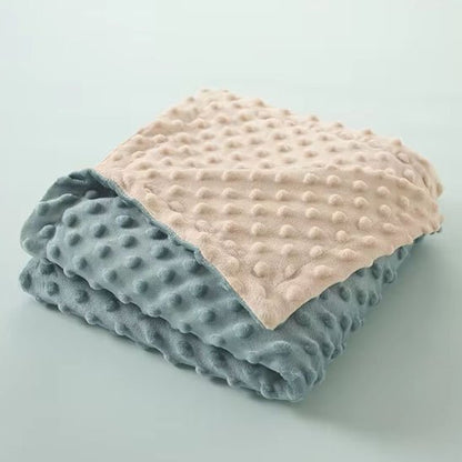 Soft minky dot baby blanket in blush and gray, cozy for infant sleep and comfort