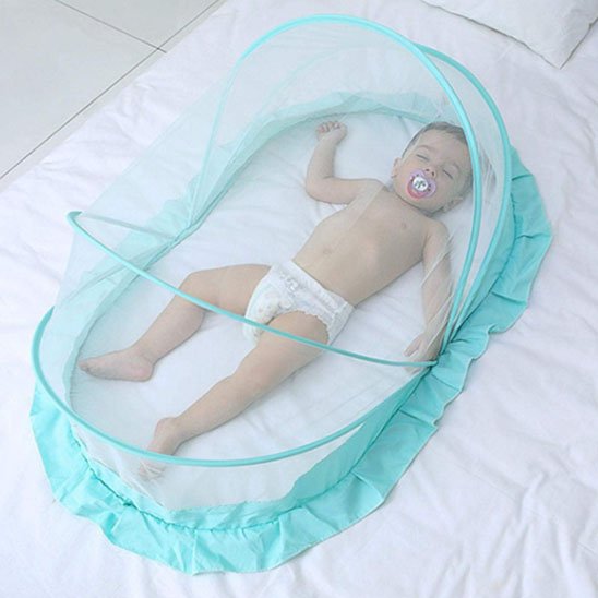 Baby sleeping peacefully in a turquoise mesh crib with pacifier, ensuring safe and cozy nights.