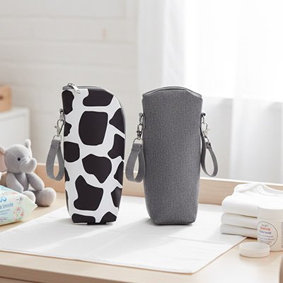Stylish baby bottle holders with cow print and gray designs, perfect for on-the-go feeding and nursery essentials.