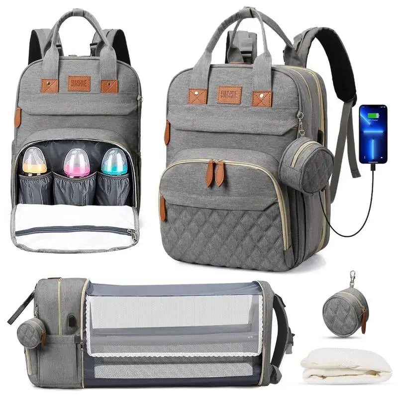 Gray diaper backpack with bottle holders, USB charging, and portable baby crib for travel and daily use