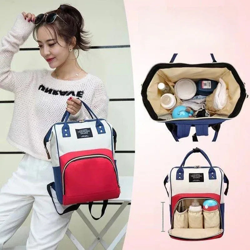 Stylish red and blue diaper bag with organized compartments for baby essentials