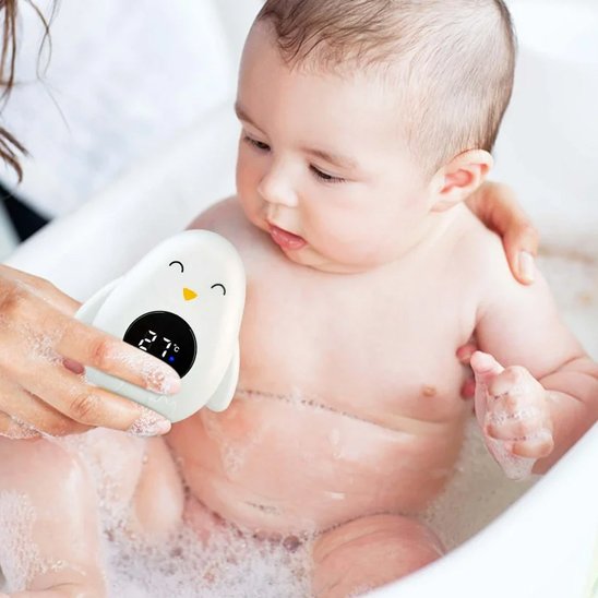 Baby bath thermometer with penguin design ensuring safe water temperature for infant bathing