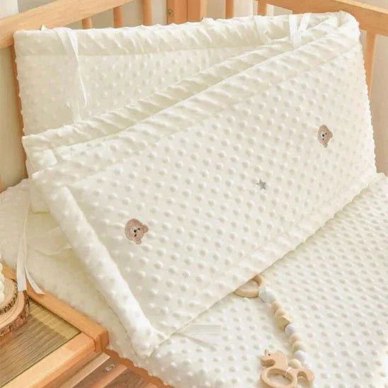 Soft white baby crib bumper with bear embroidery, cozy nursery bedding for gentle sleep