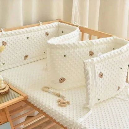Soft white baby crib bumper with teddy bear prints, cozy nursery bedding for sweet sleep