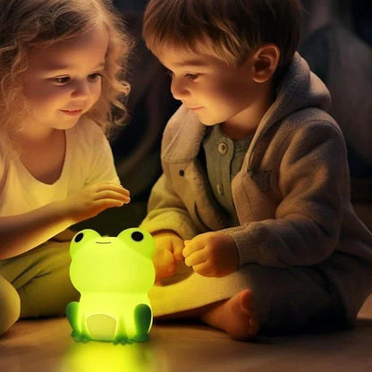 Adorable frog night light glowing softly for kids' bedtime comfort and cozy nursery ambiance