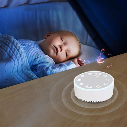 Baby sleeping peacefully with white noise machine playing lullabies for calm nights