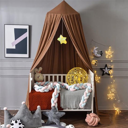 Cozy baby crib with brown canopy, star lights, and soft knit bedding for sweet sleep